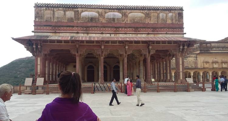 Tourists exploring the grounds of historical architecture.