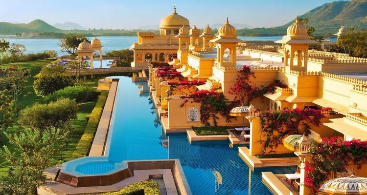 Luxurious palace with a pool and lake view.