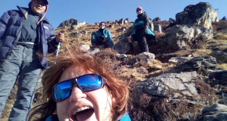 Close-up of a person hiking on a rocky mountainside.
