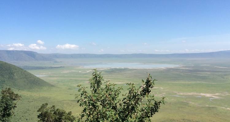 Expansive view of Ngorongoro Crater with a large lake at the center.