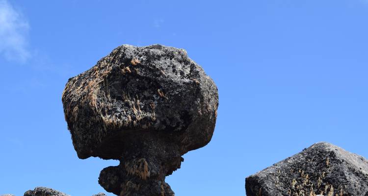 Rocks with unusual shapes set against a blue sky.