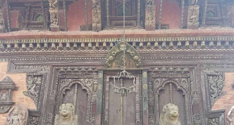 Intricate wooden carvings on a historic building facade.
