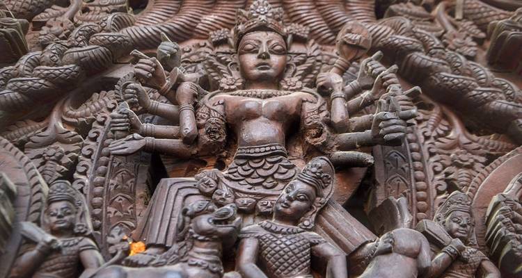 Intricate stone carving of deities.