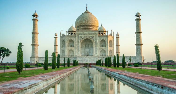 Taj Mahal with reflecting pool and landscaped gardens.