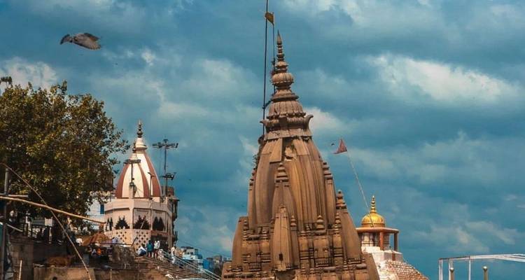 Temple spires with cloudy sky.