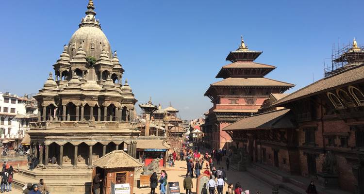 Durbar Square with traditional architecture and tourists.