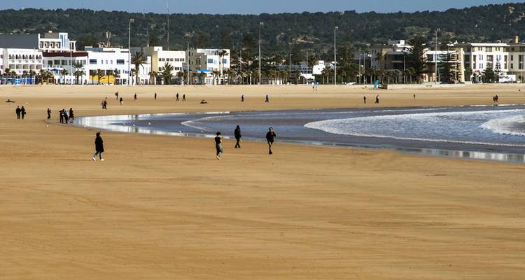 People walking on a sandy beach