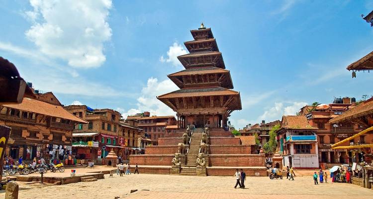 Grand Nyatapola Temple rises above the cobbled square of Bhaktapur filled with shops and traditional brick houses.