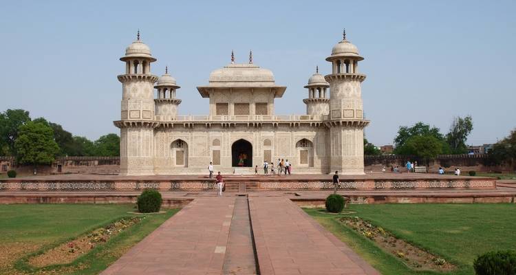 Mausoleum style building with towers, set in gardens.