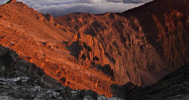 Rugged mountain landscape with sunlit peaks.