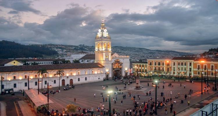 Aerial view of a city square and cathedral in Quito.