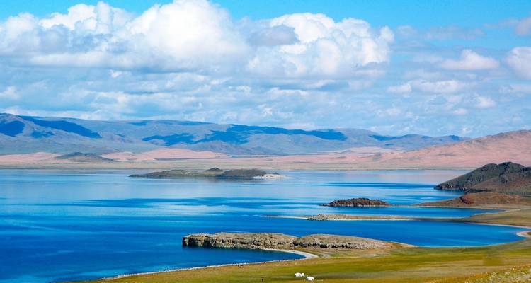 Scenic view of a lake with mountains in the background.