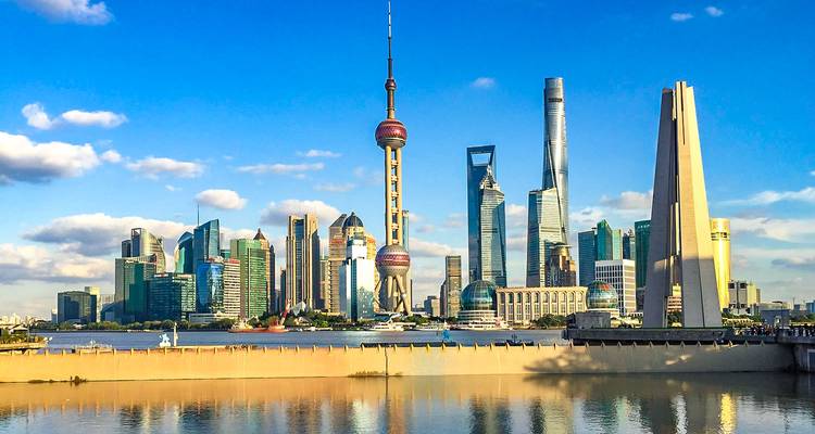 Modern skyline with prominent skyscrapers along the waterfront.