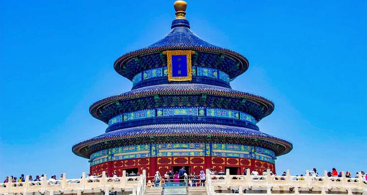 Vibrant blue-tiled Hall of Prayer for Good Harvests of Beijing’s Temple of Heaven rising against a clear sky.