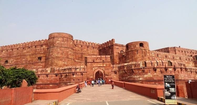 Red Fort in Agra with visitors in front.