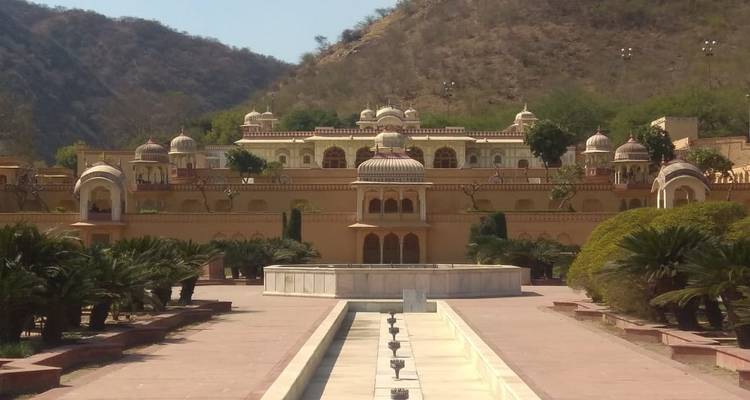 Galtaji Temple architecture surrounded by gardens.