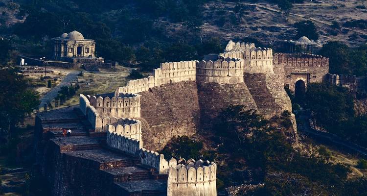 A large fort complex with impressive walls extending across the hillside.
