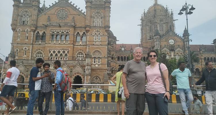 Tourists posing outside a historic building.
