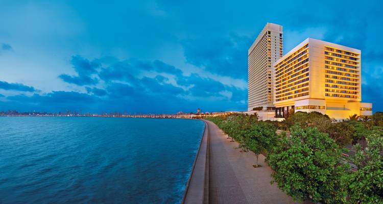 Marine Drive promenade with a hotel and sea view.