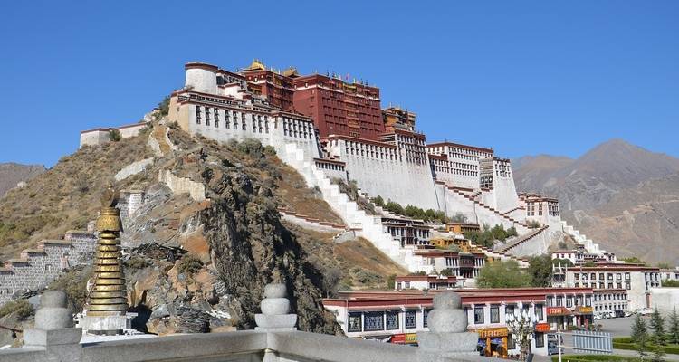 Potala Palace on a hill with clear blue sky.