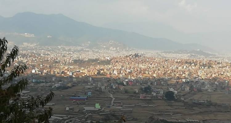 Panoramic view of a city in a valley.