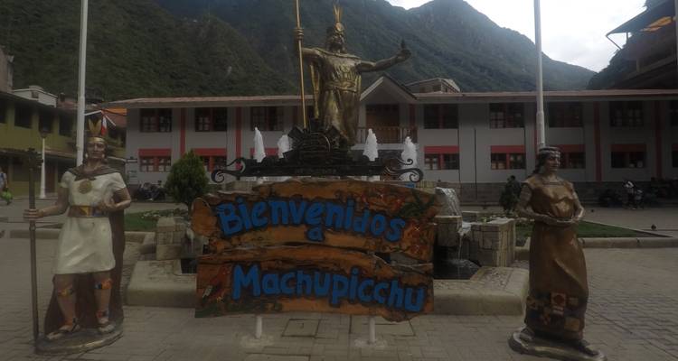 Decorative Machu Picchu sign with statues.