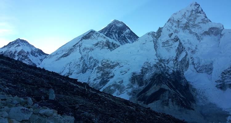 Mountain range with snow and clear skies.