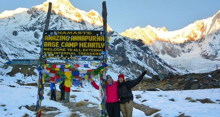 Trekkers celebrating at Annapurna Base Camp.