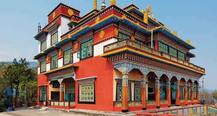 Colorful monastery with intricate paintings and carvings.
