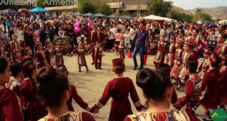 Traditional Armenian dance festival with children in costumes.