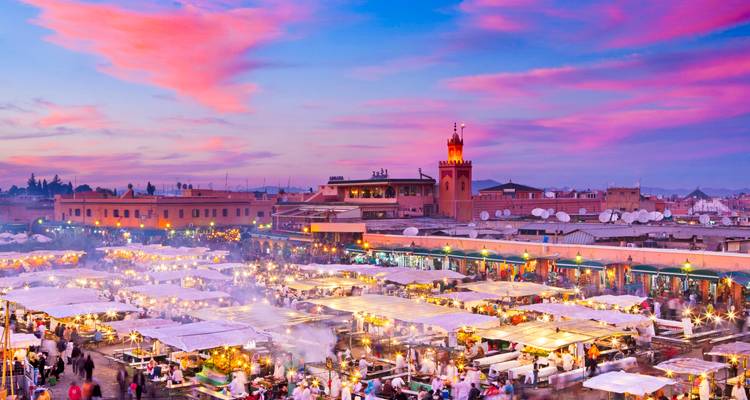 Vibrant sunset over a Moroccan market.