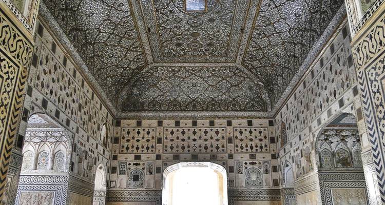 Intricately decorated interior with reflecting glass and patterns.