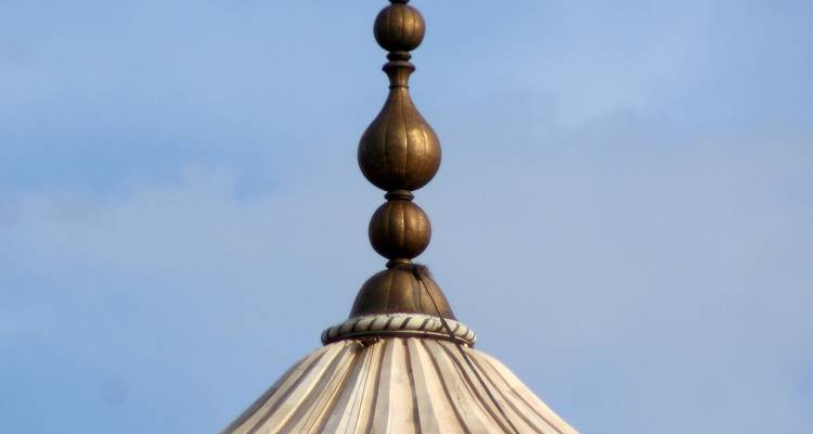 Close-up of a decorative finial on top of a dome.