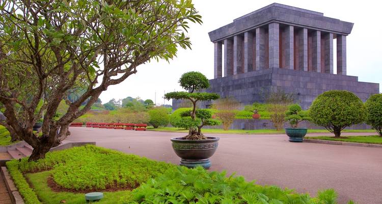Ho Chi Minh Mausoleum with gardens and tourists.