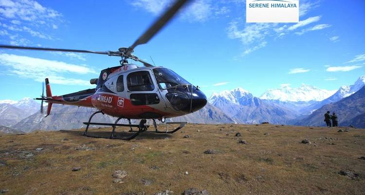 Landing helicopter with mountains in the background.