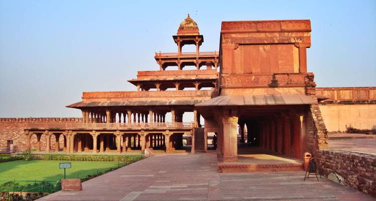 Historic building with multiple tiers and pillars.
