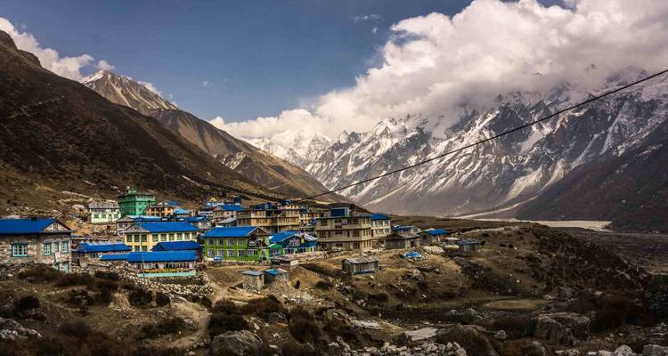 Village in a valley surrounded by mountains.
