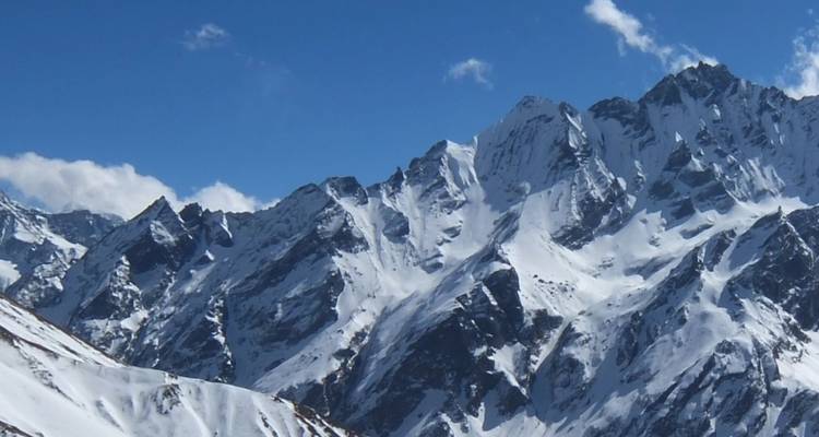 Snowy mountain peaks under a clear blue sky.