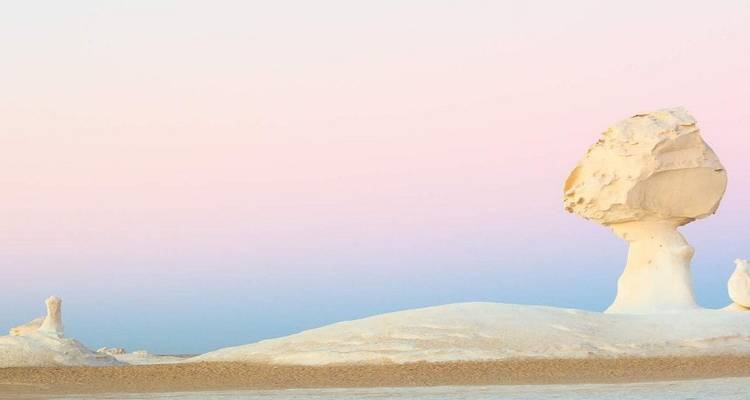 White rock formation in the White Desert during sunset.