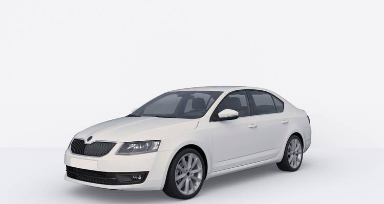 Een witte sedan getoond van voren in een studio-omgeving.