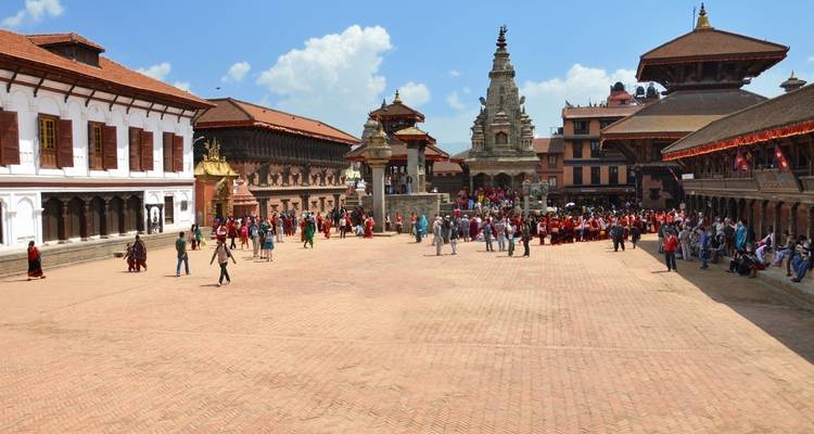 Historic square with many visitors and traditional architecture
