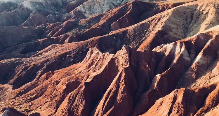 Aerial view of dramatic red rock formations.