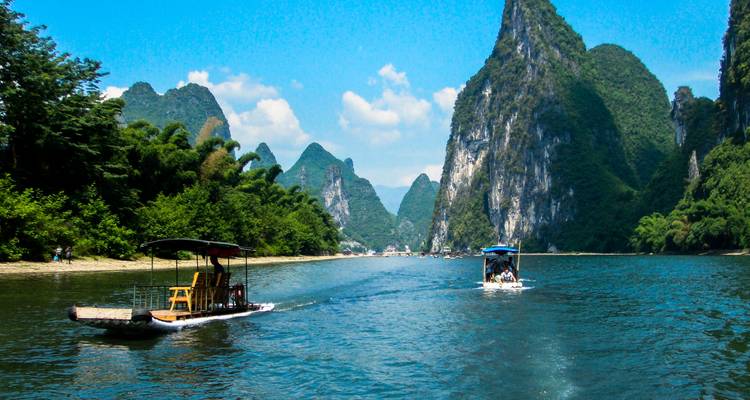 River with boats and picturesque karst formations.