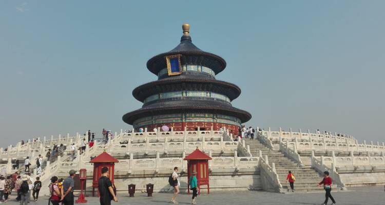 Temple of Heaven with tourists on a sunny day.