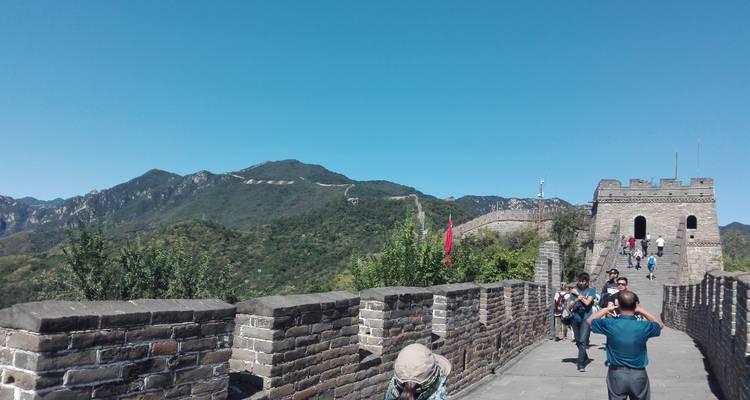 The Great Wall of China with tourists in the foreground.