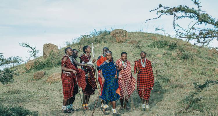 Group of people wearing traditional Maasai clothing.
