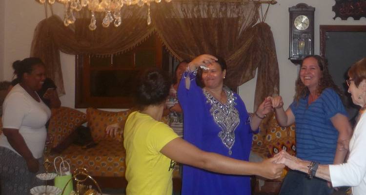 Indoor scene with people dancing and having fun.