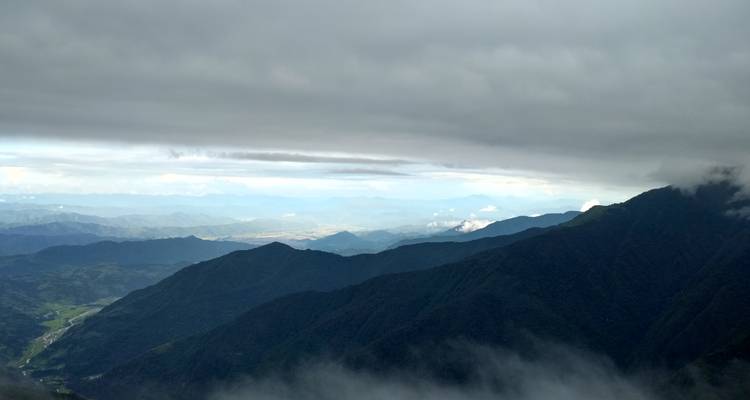 Panoramic view of mountains and clouds.