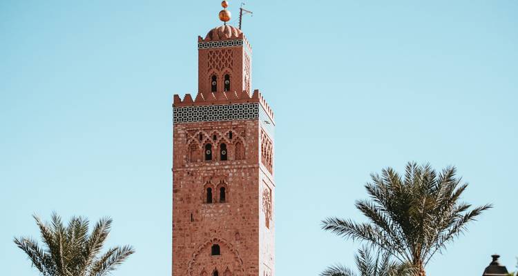 Koutoubia Mosque in Marrakesh against a clear sky.