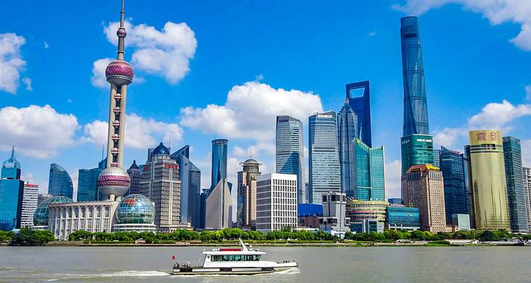 Shanghai skyline with the Oriental Pearl Tower and modern skyscrapers.